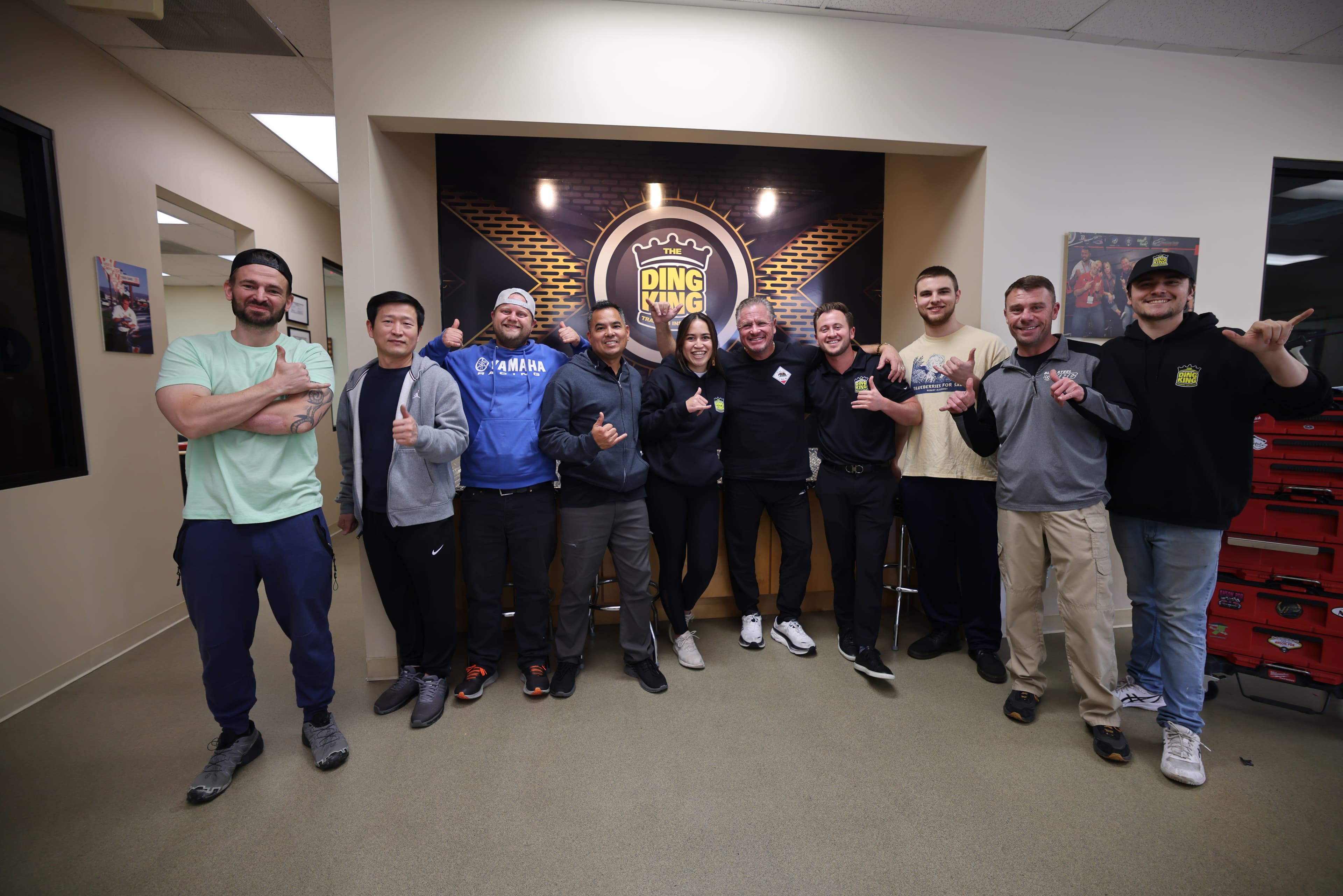 A diverse group of Graduates to Greatness students together at the reconditioning training facility