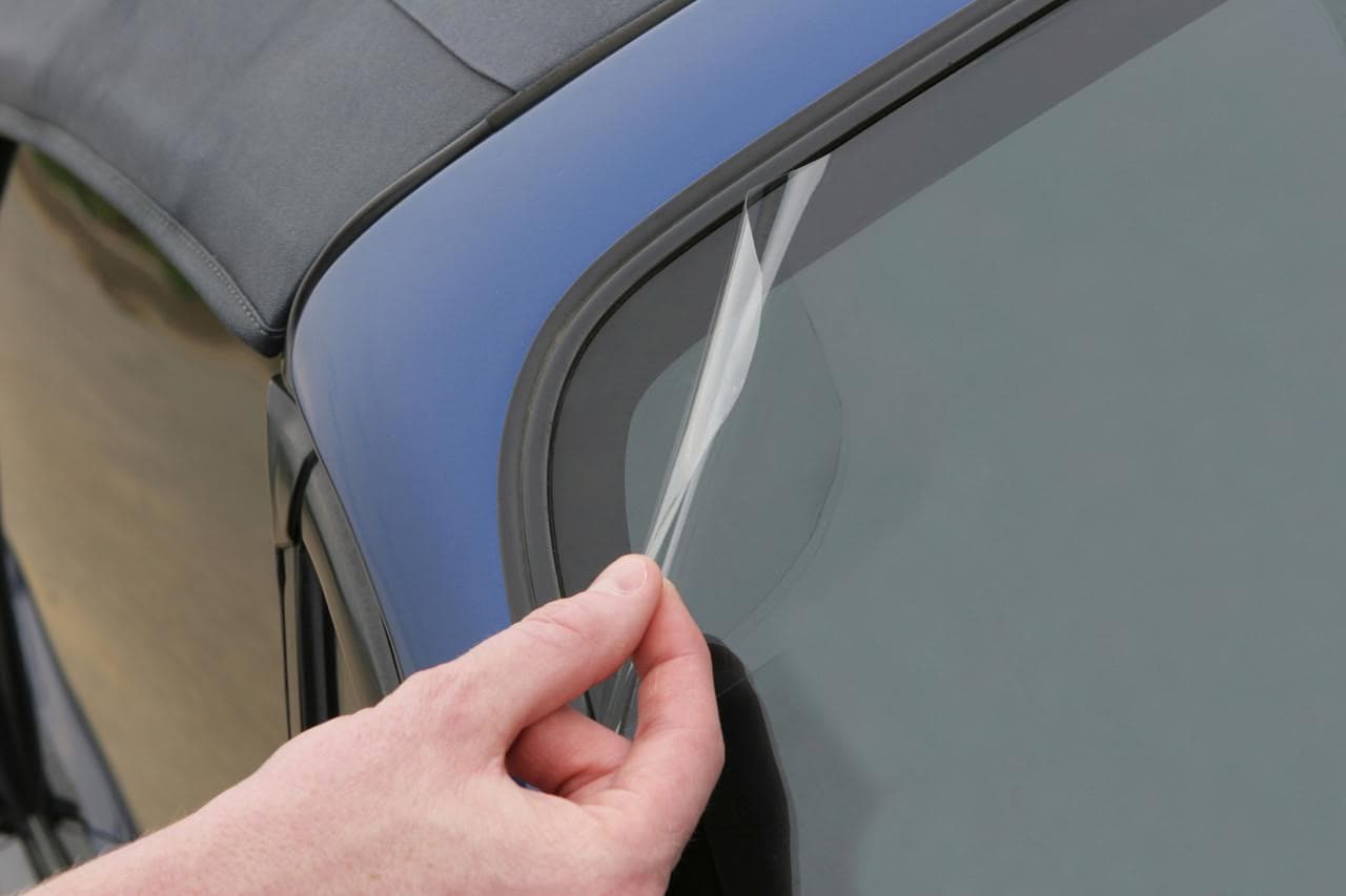 Hands-on windshield protection film training in progress
