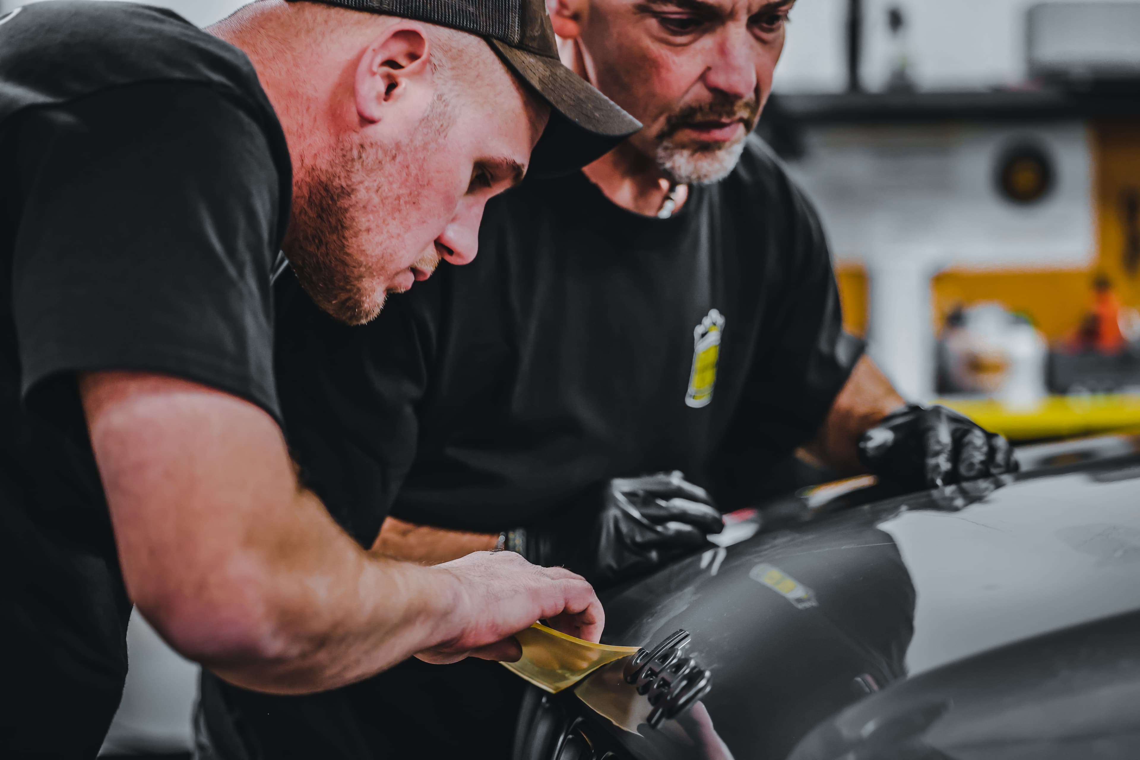 Hands-on paint chip repair training in progress