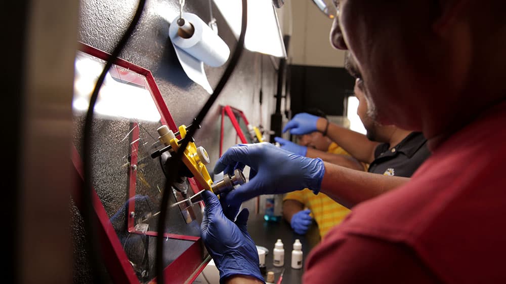 Hands-on windshield repair training in progress